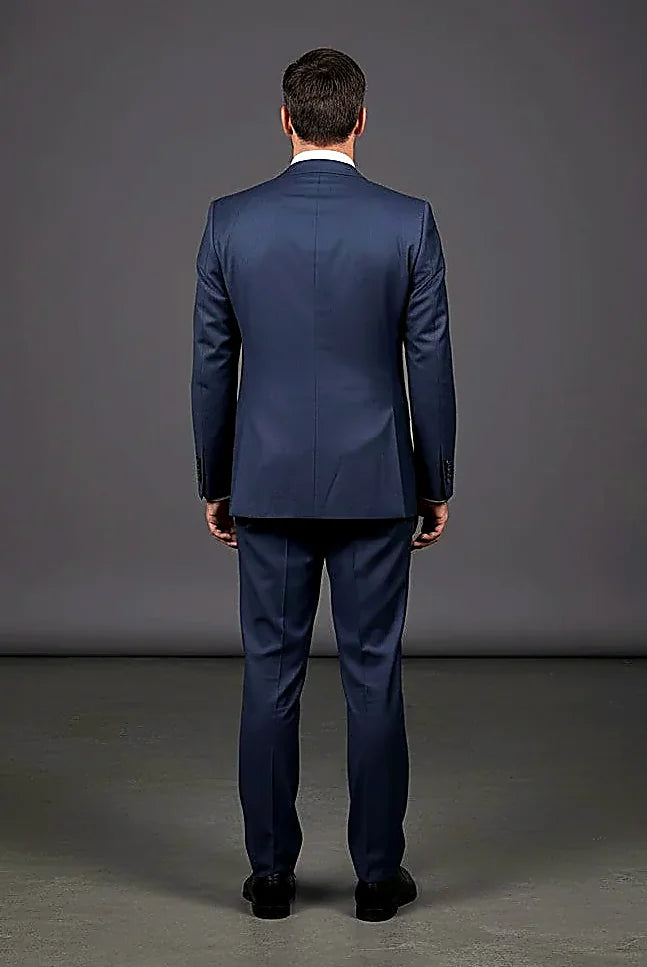 a structured blazer beside its coordinating vest, on this blue Tailored Three-Piece
