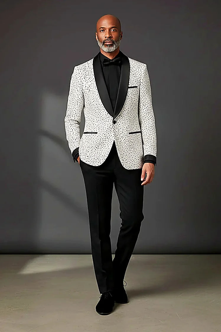 black polka dots on white beneath a velvet shawl lapel