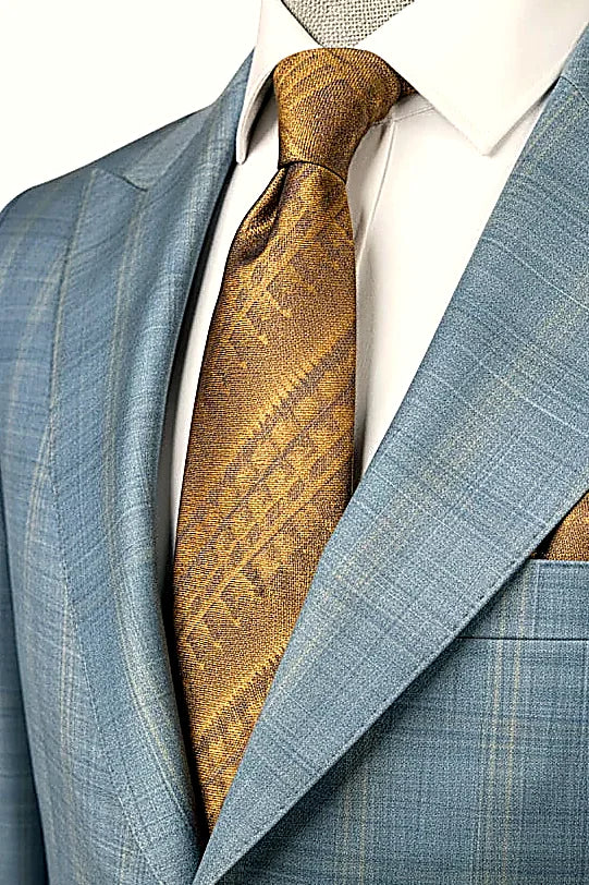 finest wool tailored into a clean two-piece silhouette, on this light Blue Wool Two-Piece Suit
