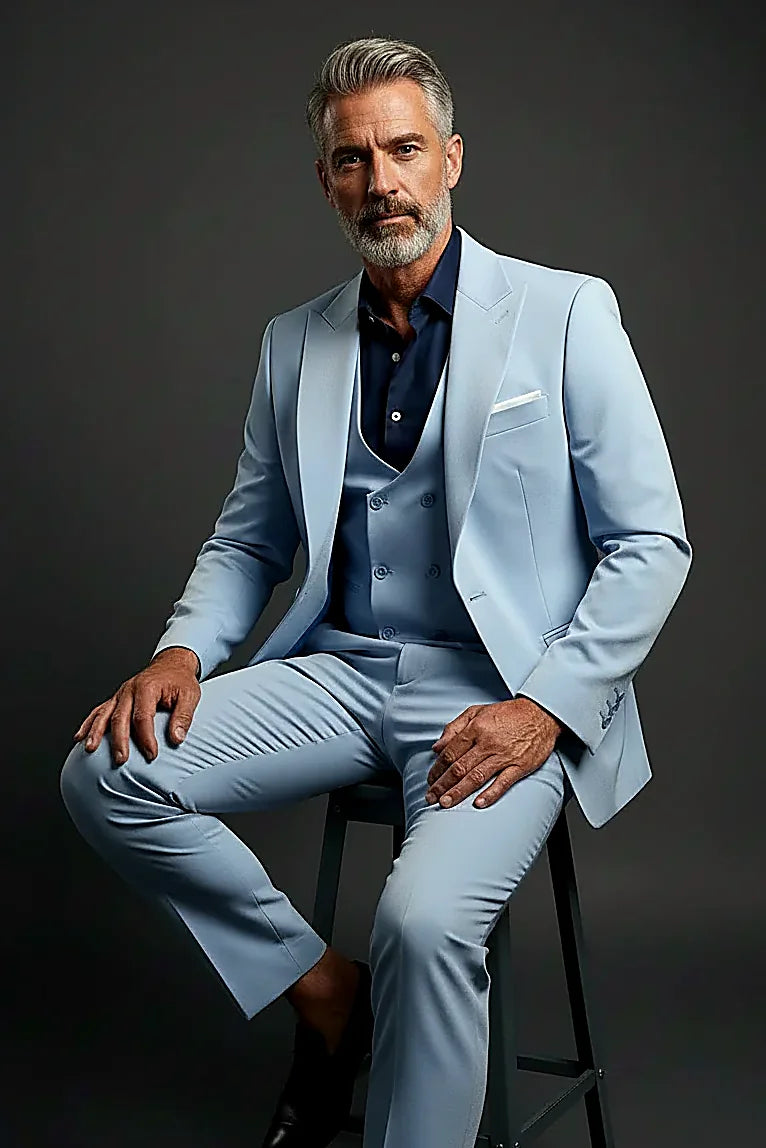 peak lapels above a six-button double-breasted waistcoat, on this light Blue Three-Piece Suit