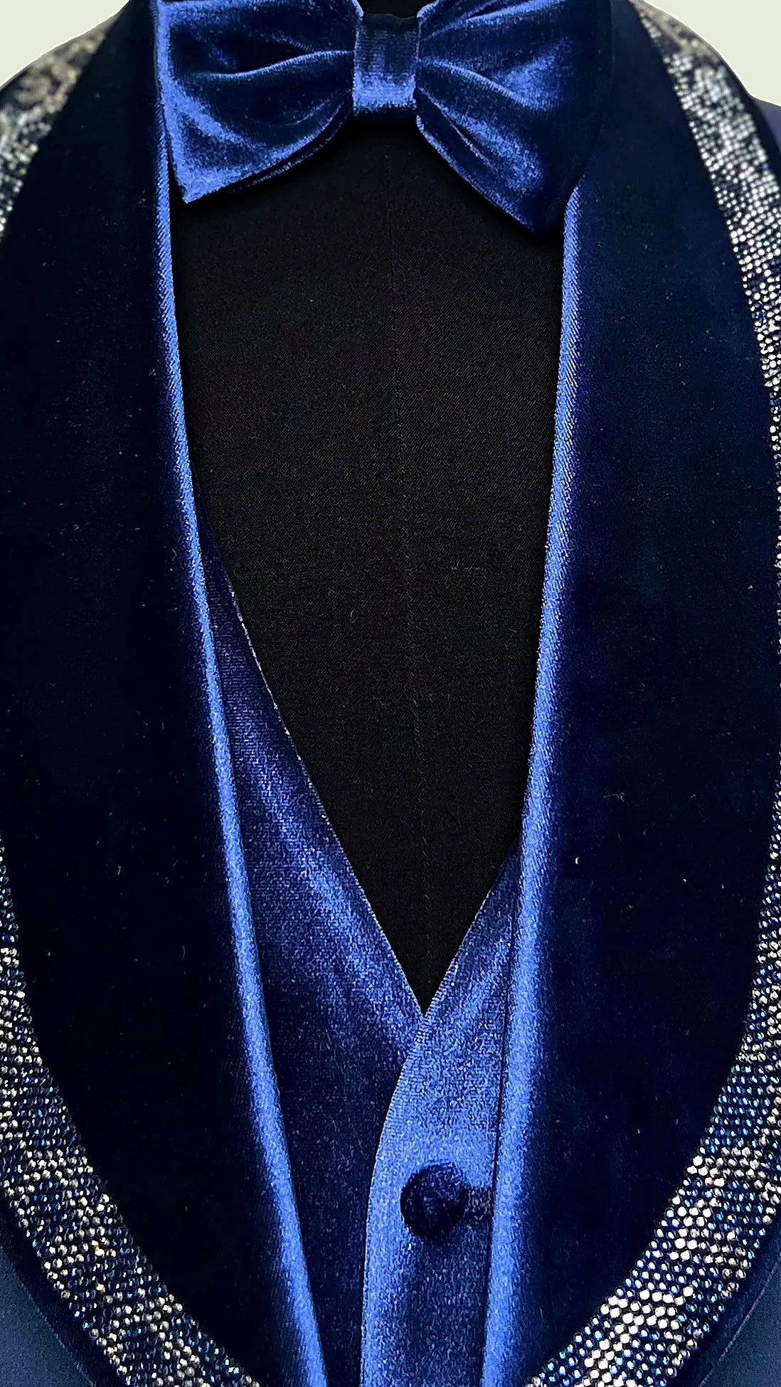 hand-applied crystals catching light along a velvet shawl lapel