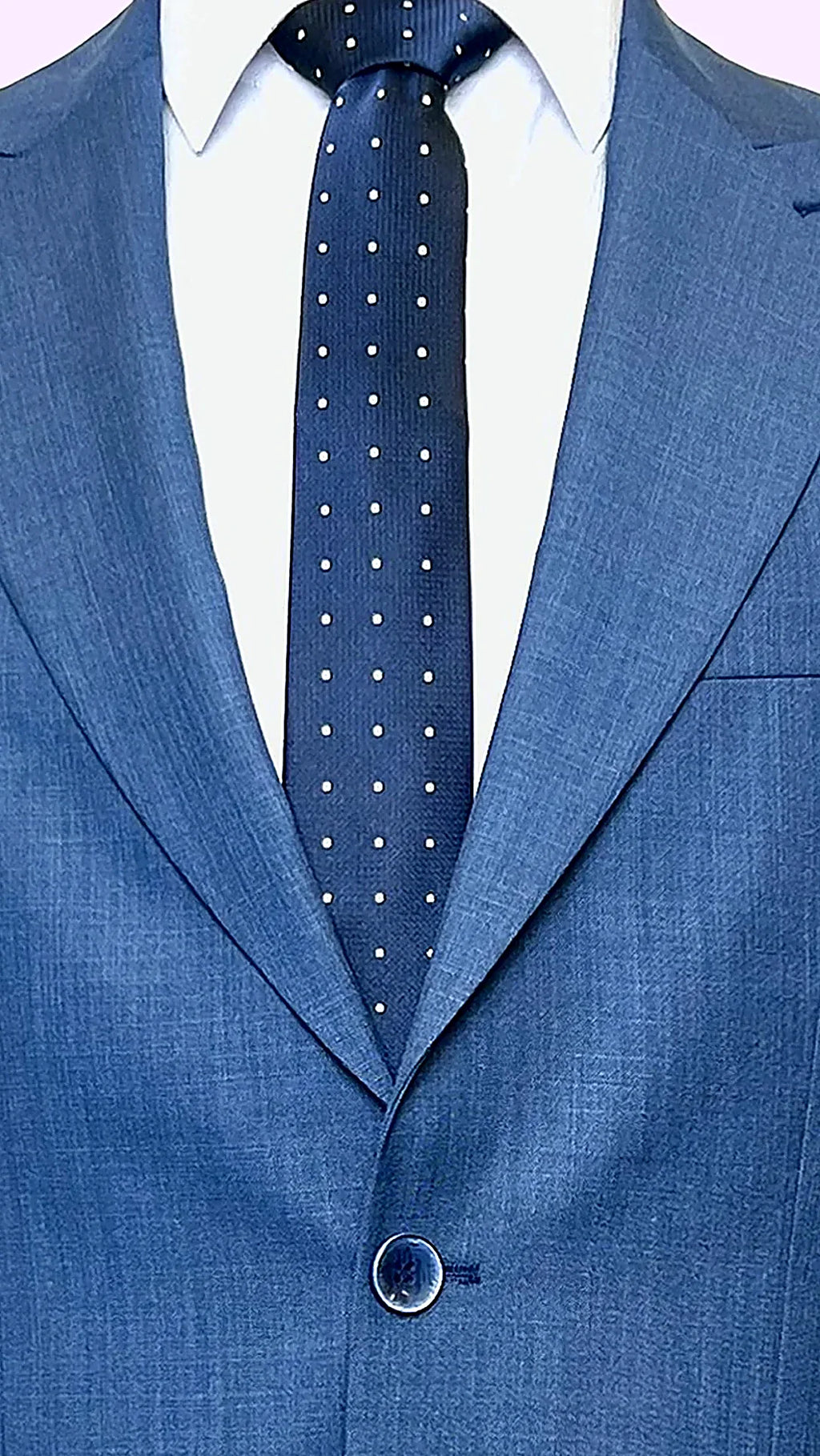 Blue Textured Business Suit showing paisley lining in earth tones behind textured blue cloth