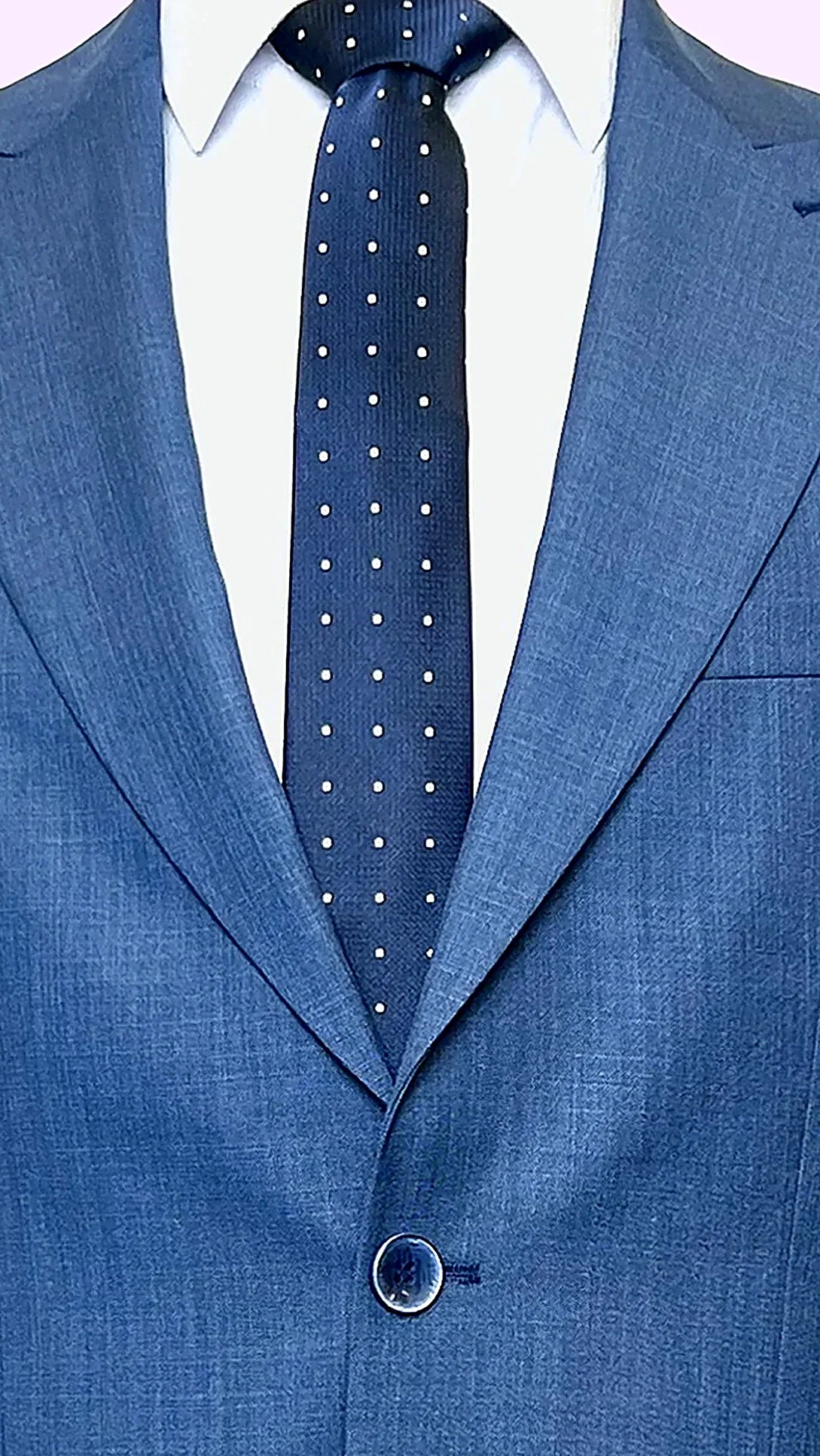 Blue Textured Business Suit showing paisley lining in earth tones behind textured blue cloth