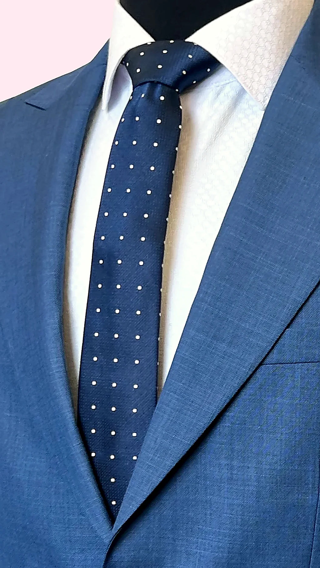 paisley lining in earth tones behind textured blue cloth