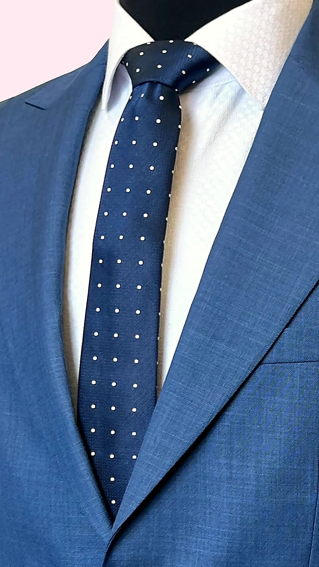 paisley lining in earth tones behind textured blue cloth