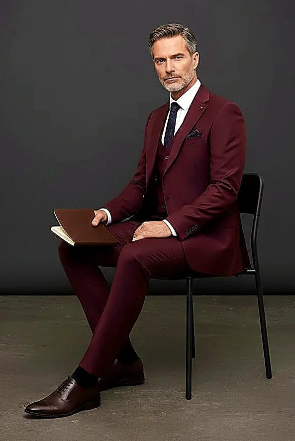 an intricately patterned lining inside deep burgundy cloth, on this burgundy Three-Piece Suit